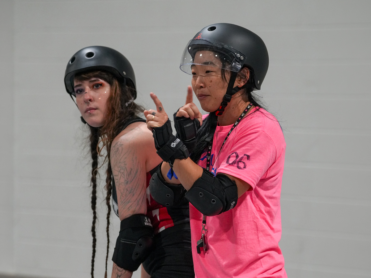 Shorty actively coaching or interacting with skaters